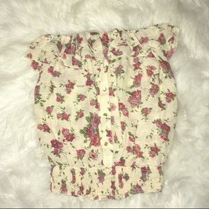 A stylish tube top covered in red roses